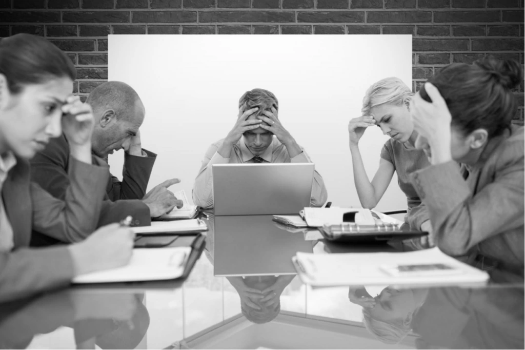 Stressed Professionals in Conference Table